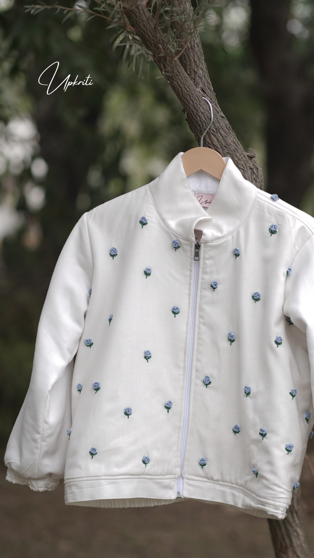 White woolen jacket with blue florals