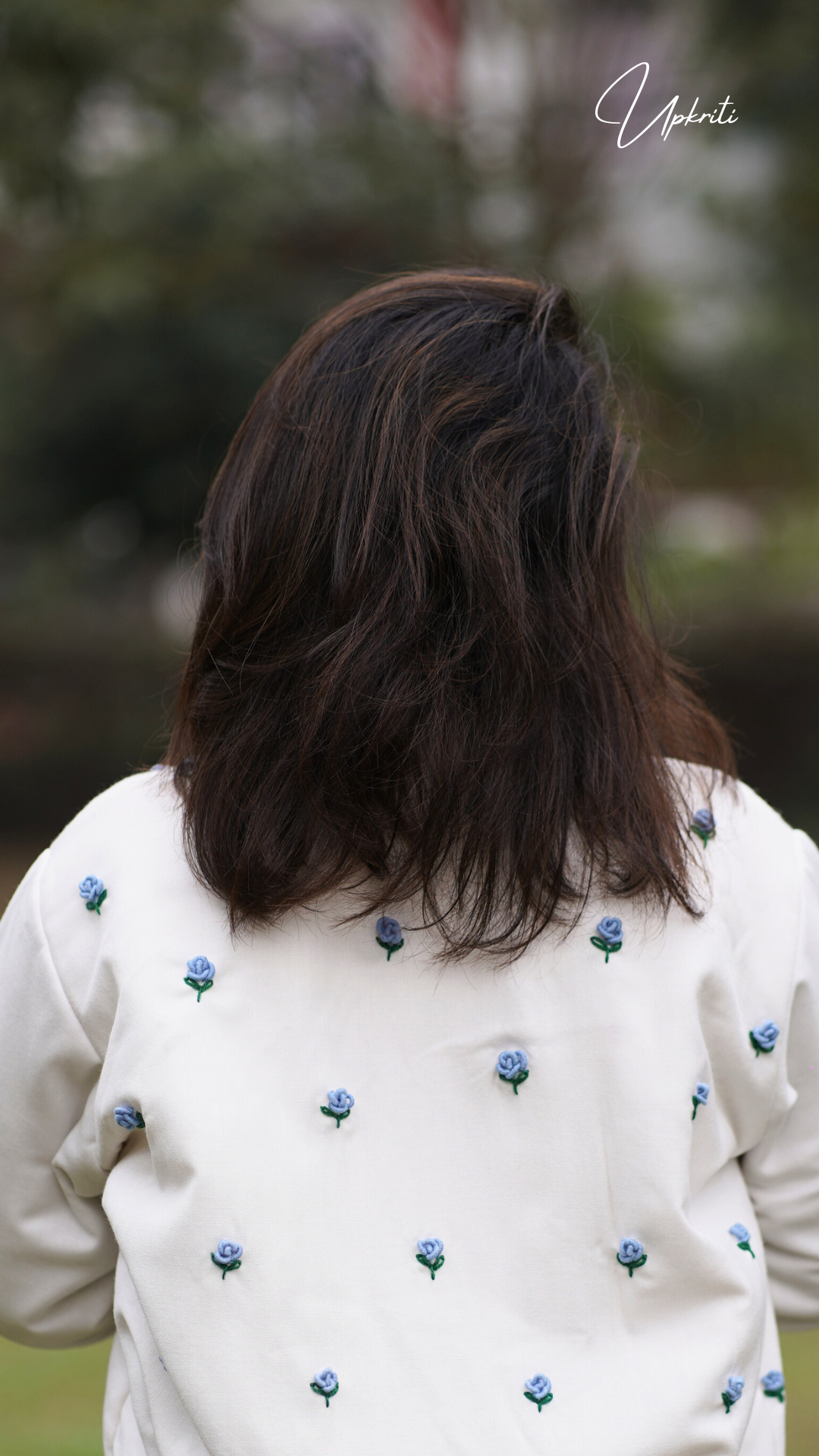 White woolen jacket with blue florals